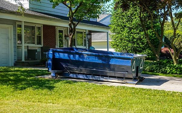 residential dumpsters can be placed on a driveway or yard, but preventative measures should be required to avoid damage to the property